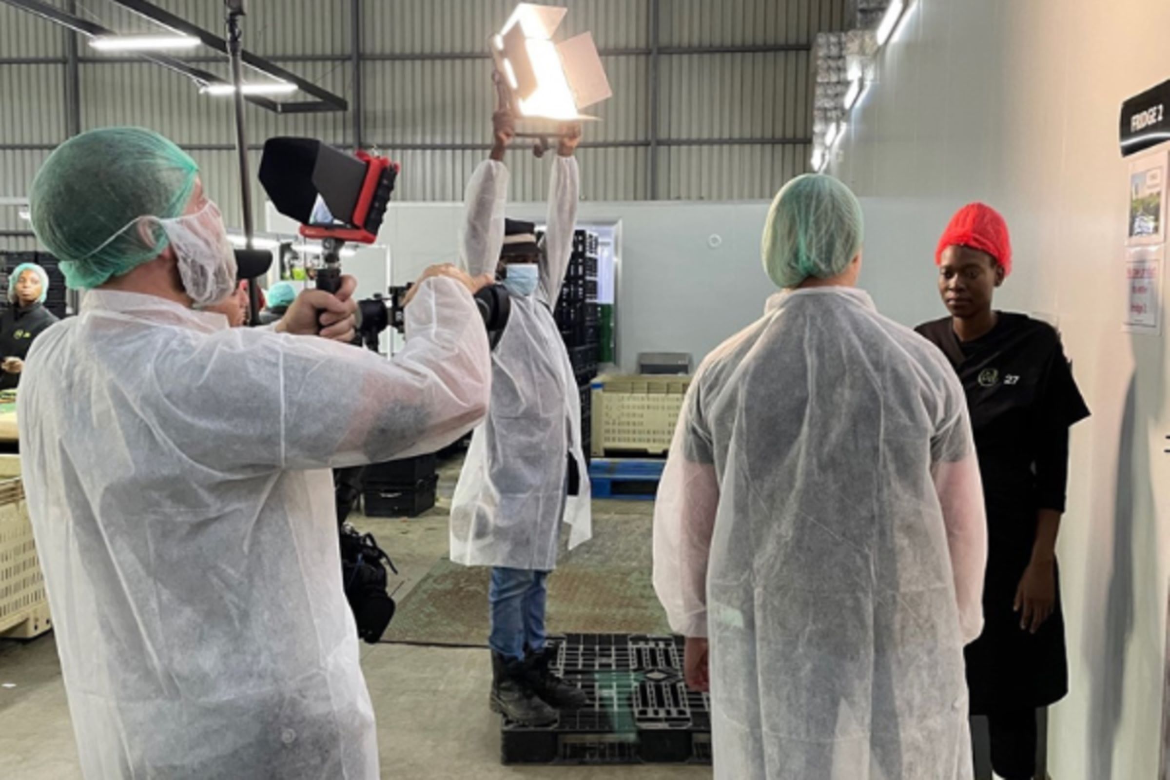Image of team members filming the virtual farm visit in South Africa