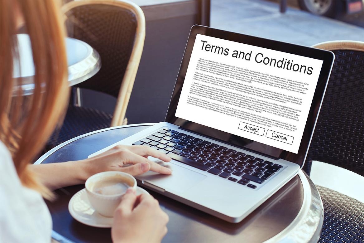 Image of a Registered Trainer reading the program terms and conditions