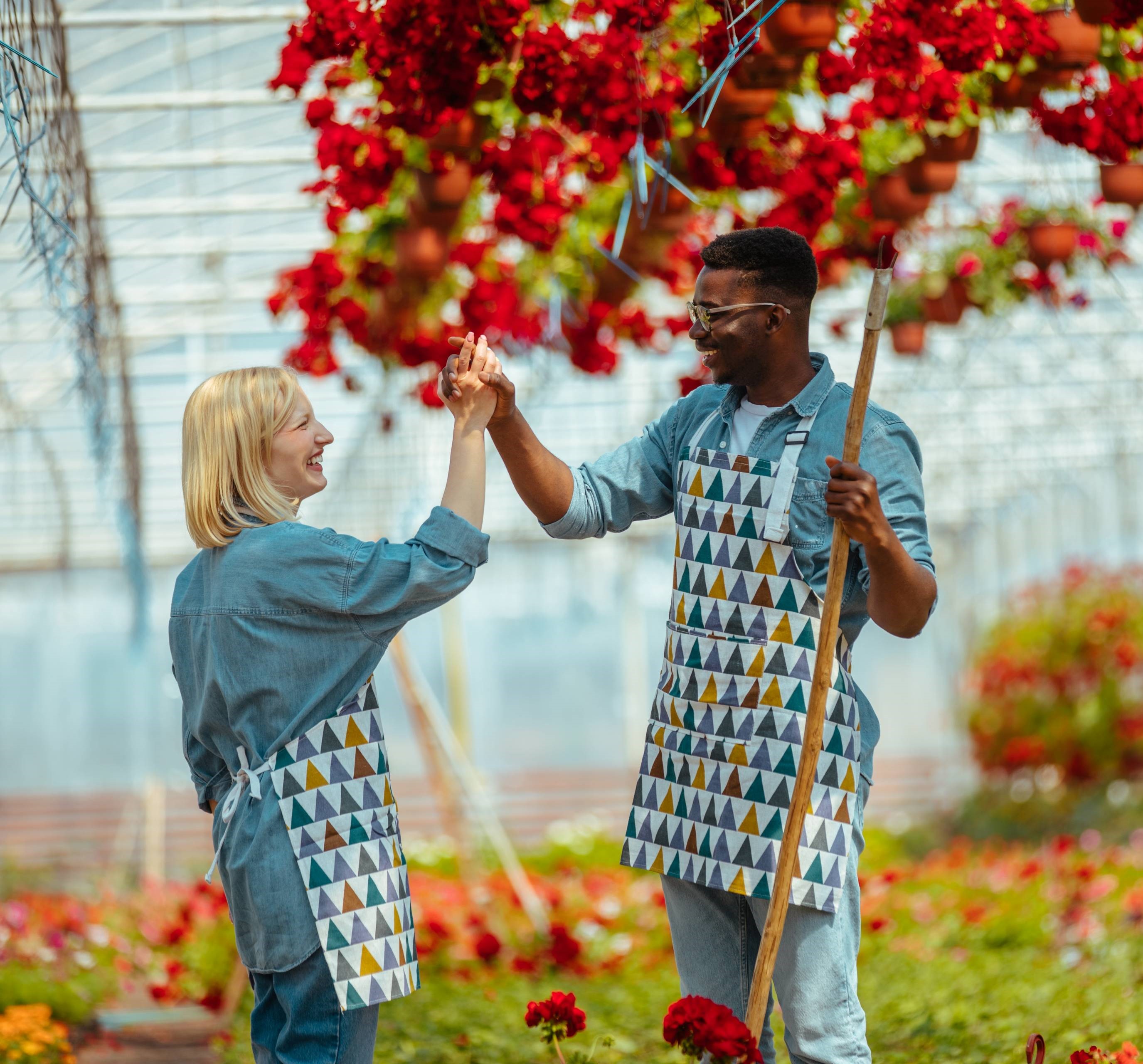 Image of two agricultural workers in a greenhouse