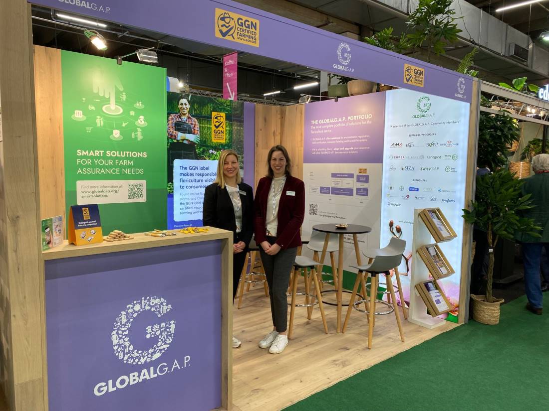 Team members at the GLOBALG.A.P. booth at IPM trade fair in Essen, 2023