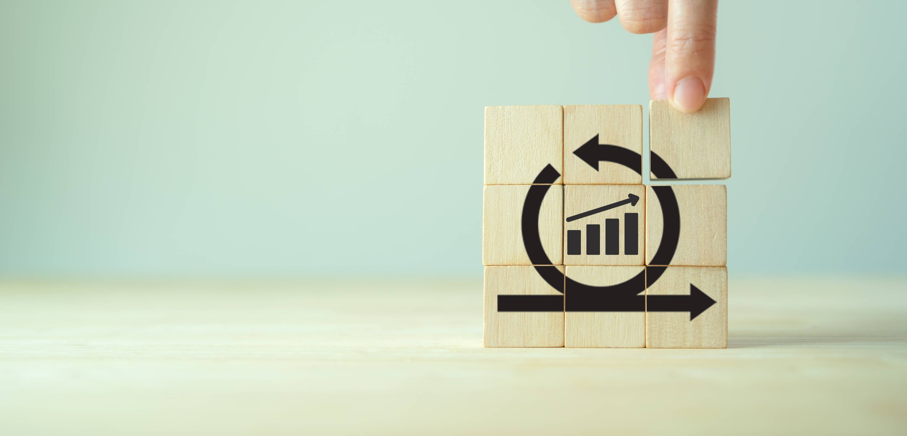 Image of wooden blocks assembled to represent expert input and progress