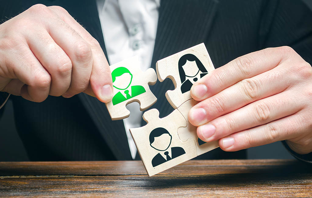 Image of a jigsaw with individuals being assembled to form a group