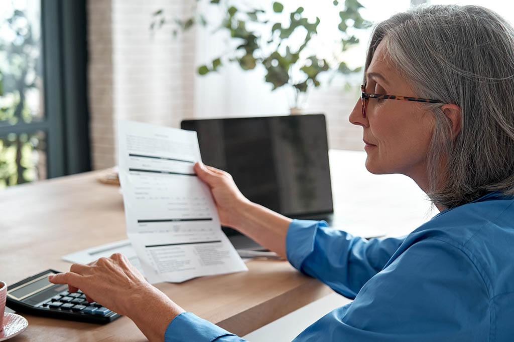 Image of a person paying an invoice