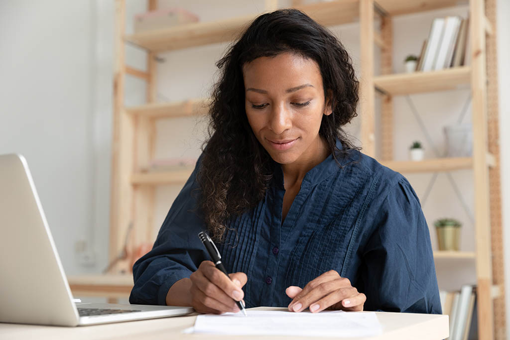 Image of a technical expert completing an application form