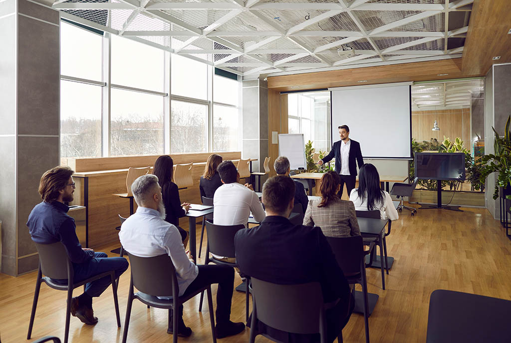 Image of a master trainer instructing a group of Registered Trainer program applicants