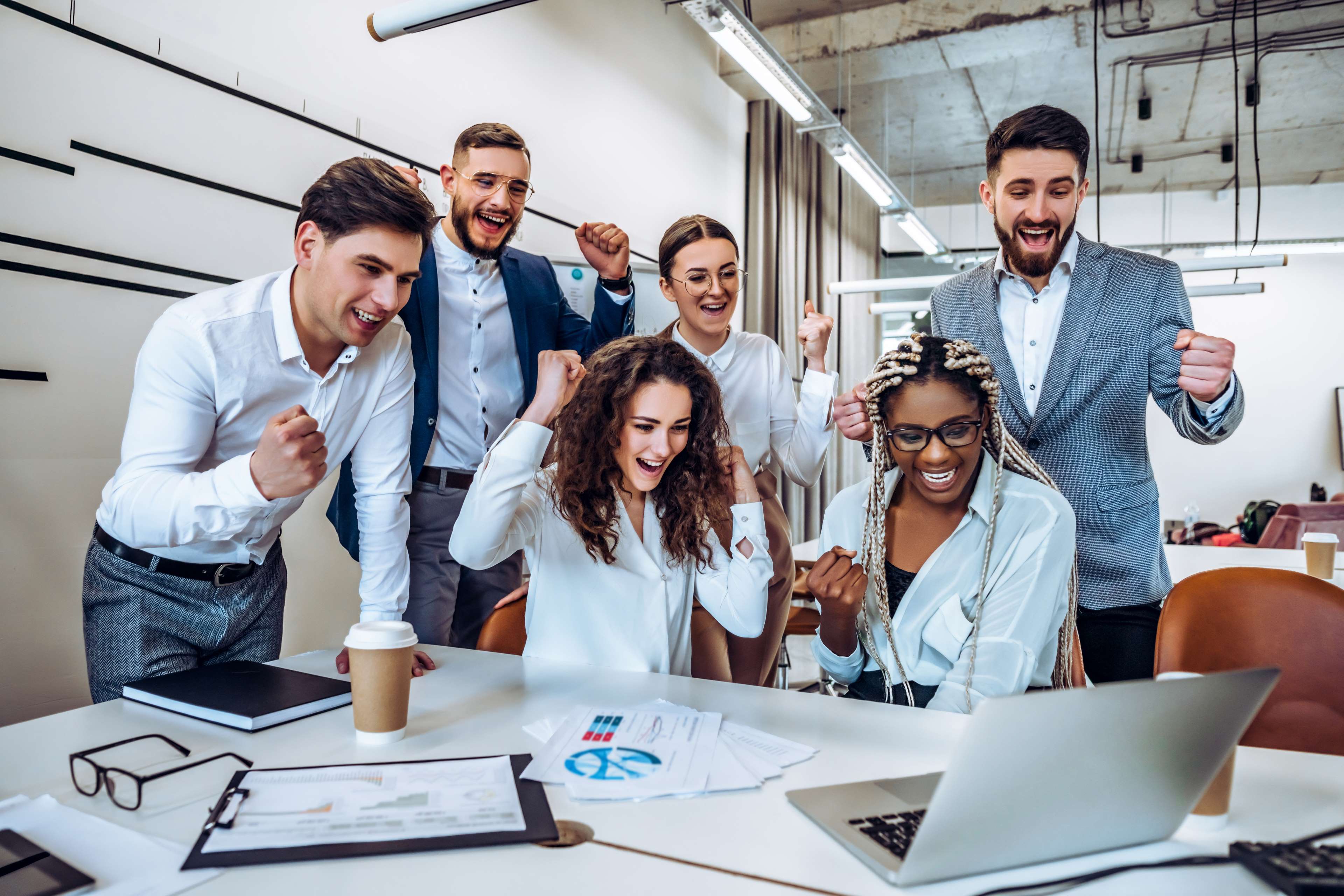 Image of a group of colleagues celebrating the end of a project
