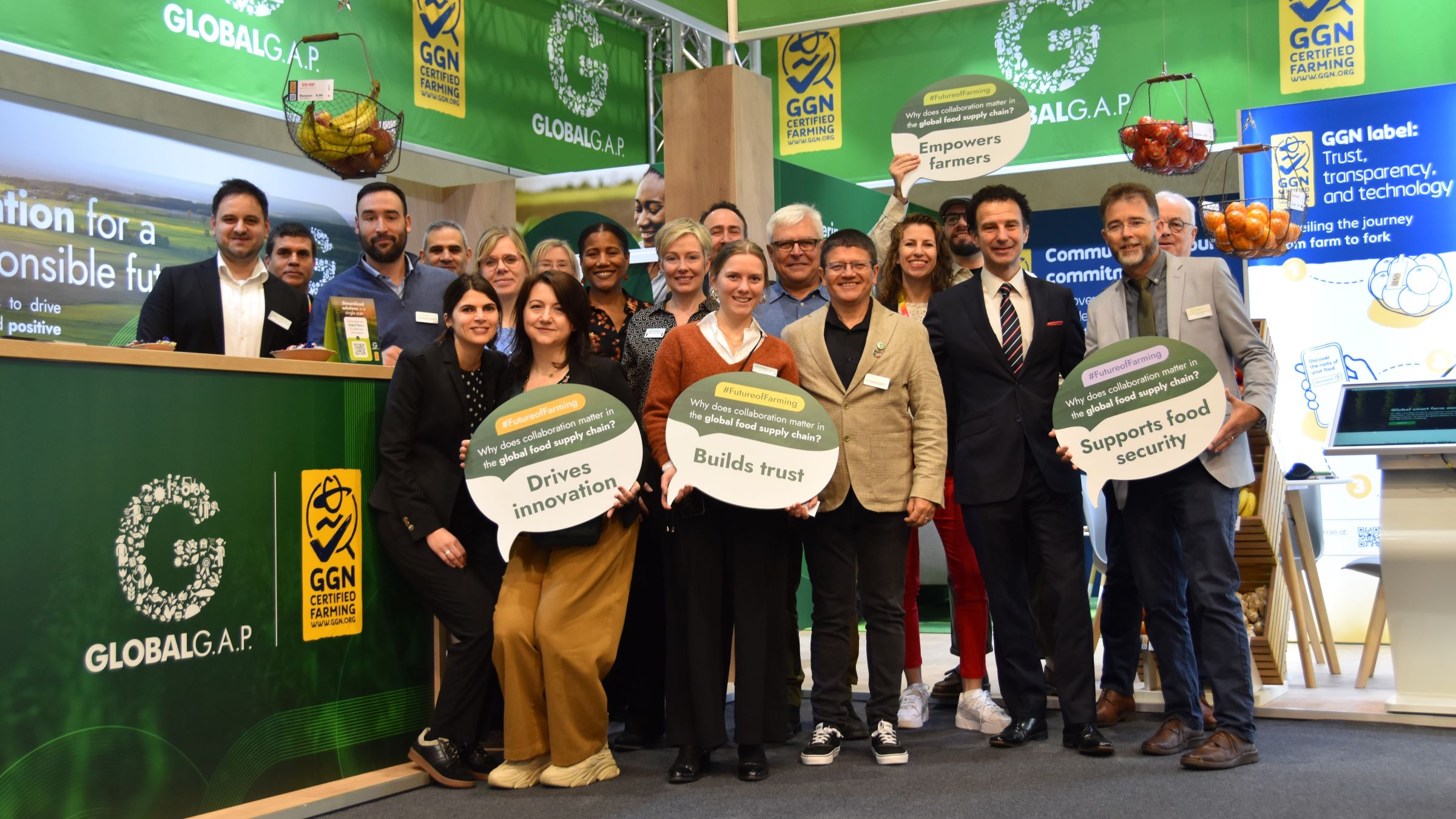 The GLOBALG.A.P. team poses in the booth at Fruit Logistica 2025 in Berlin, Germany
