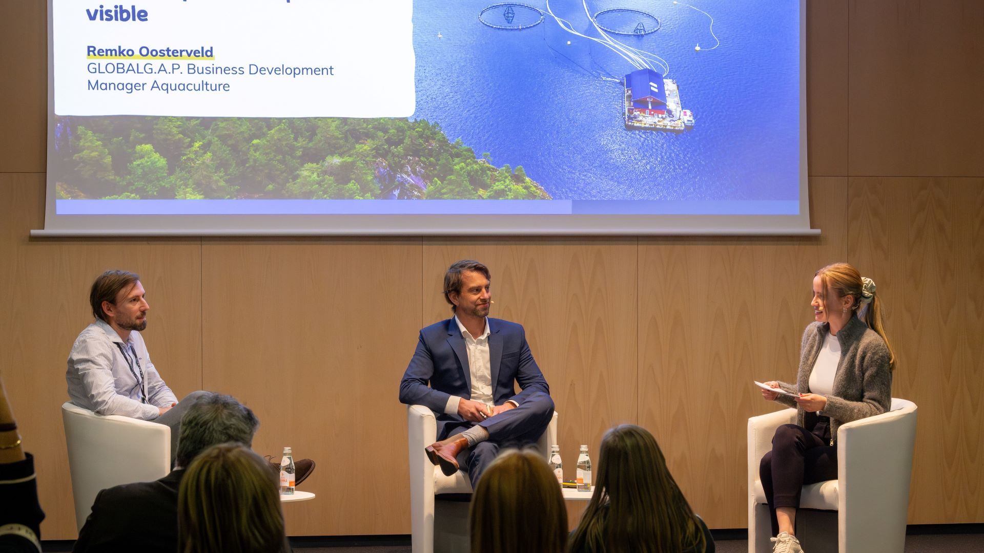 József Bárdos, Remko Oosterveld, and Leonie Fischer on stage of the SEG 2025 sponsored session